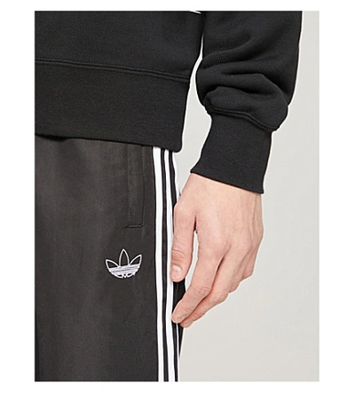 Shop Adidas Originals Logo-print Shell Jogging Bottoms In Black