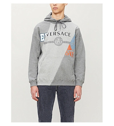 Shop Versace Logo-print Cotton-jersey Hoody In Grigio+chiaro+melange