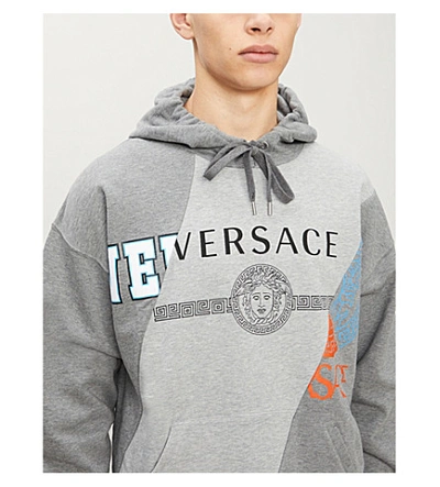 Shop Versace Logo-print Cotton-jersey Hoody In Grigio+chiaro+melange