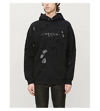 Shop Givenchy Distressed Logo-print Cotton-jersey Hoody In Black