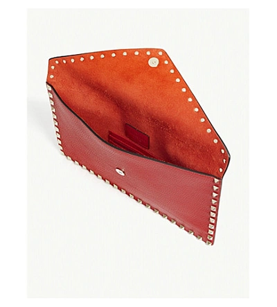 Shop Valentino Rockstud Envelope Leather Clutch In Rouge Pur