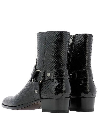 Shop Saint Laurent Wyatt Harness Boots In Black