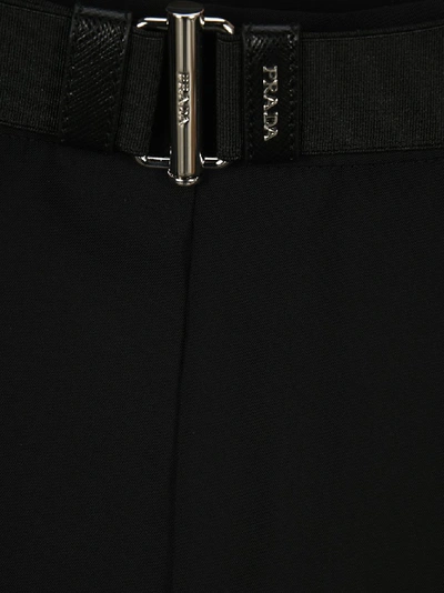 Shop Prada Logo Engraved Belted Flounce Skirt In Black