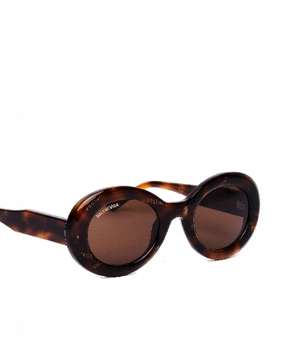Shop Balenciaga Logo Printed Oval Sunglasses In Brown