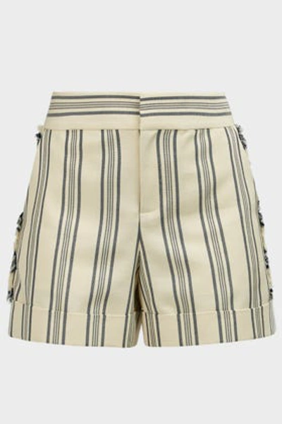 Shop Monse Fringed Striped Cotton-blend Shorts