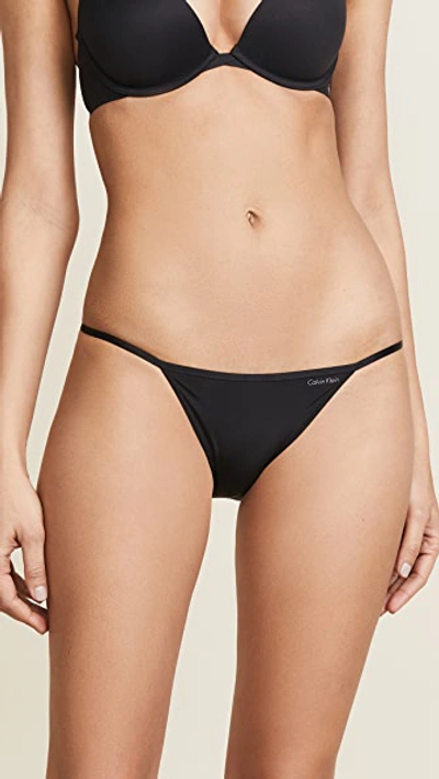 Shop Calvin Klein Underwear Sleek String Bikini Panties In Black