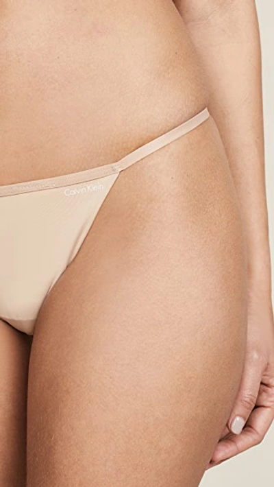Shop Calvin Klein Underwear Sleek Model Thong Bare L
