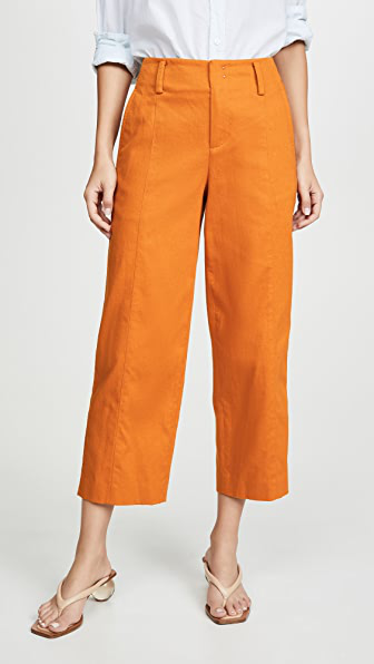 orange cropped trousers