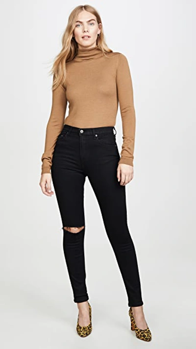 Shop Reformation High & Skinny Jeans In Faded Black Destroyed