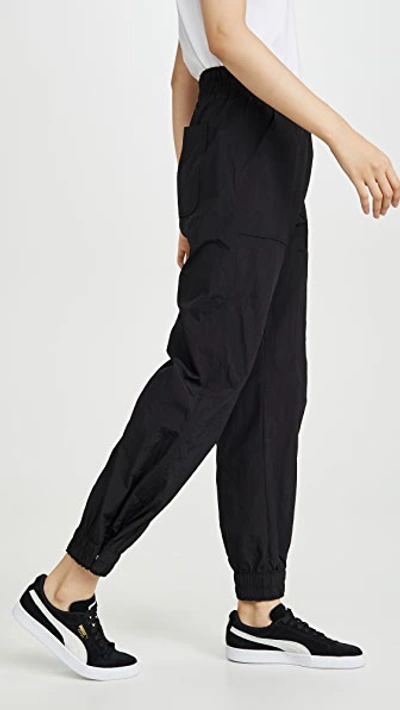 Shop Ganni Tech Pants In Black