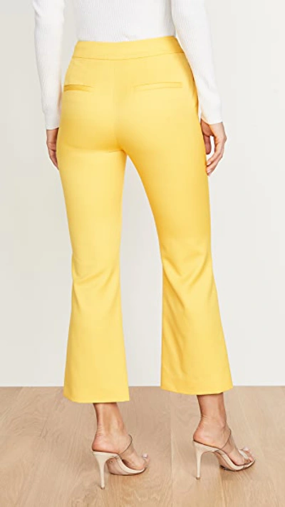 Shop Adam Lippes Tropical Bell Crop Trousers In Canary