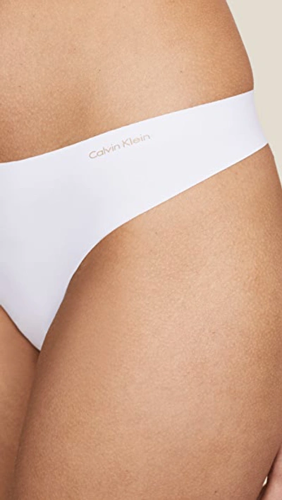 Shop Calvin Klein Underwear Invisibles Thong In White