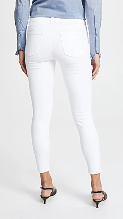Shop J Brand 835 Mid Rise Capri Jeans In Blanc