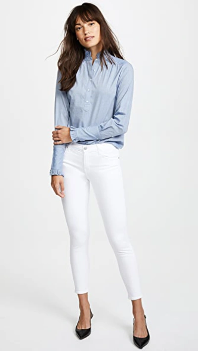 Shop J Brand 835 Mid Rise Capri Jeans In Blanc