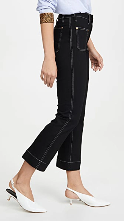 Shop Khaite Raquel Patch Cropped Flare Jeans In Black Rinse Ivory Topstitch