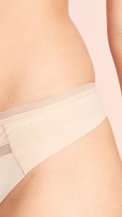Shop Calvin Klein Underwear Invisibles With Mesh Thong In Bare