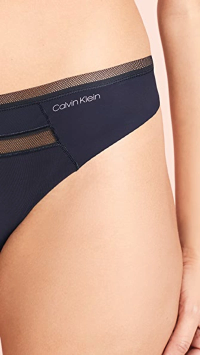 Shop Calvin Klein Underwear Invisibles With Mesh Thong In Black
