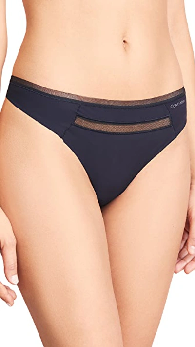 Shop Calvin Klein Underwear Invisibles With Mesh Thong In Black
