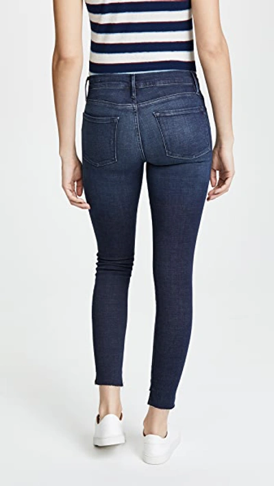 Shop Frame Le Skinny De Jeanne Stagger Hem Jeans In Galvin