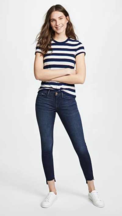 Shop Frame Le Skinny De Jeanne Stagger Hem Jeans In Galvin