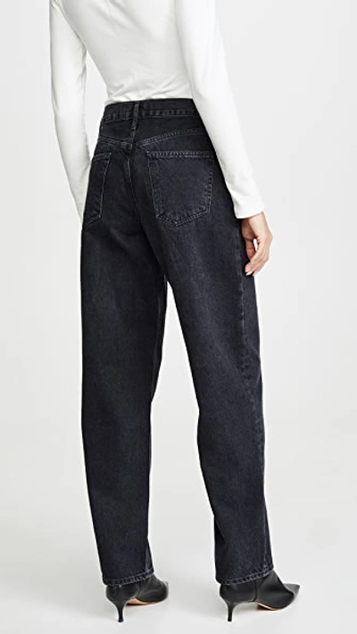 Shop Agolde Pleated Baggy Mid Rise Jeans In Cave