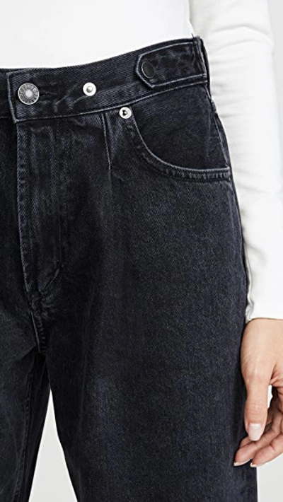 Shop Agolde Pleated Baggy Mid Rise Jeans In Cave