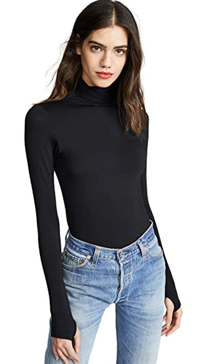 Shop Enza Costa Fitted Long Sleeve Turtleneck In Black