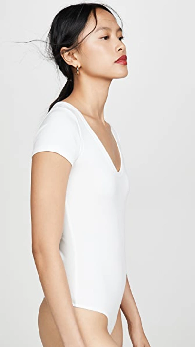 Shop Agolde Short Sleeve Rib Thong Bodysuit In White