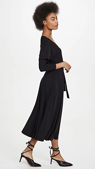 Shop Norma Kamali Dolman Wrap Flared Dress In Black