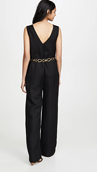 Shop Solid & Striped Linen Jumpsuit In Black