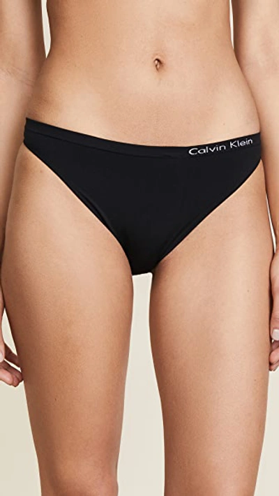 Shop Calvin Klein Underwear Pure Seamless Thong In Black