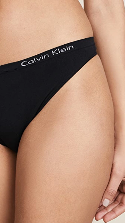 Shop Calvin Klein Underwear Pure Seamless Thong In Black