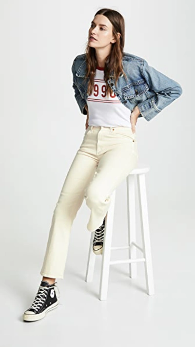 Shop Khaite Vivian New Bootcut Flare Jeans Denim Ivory