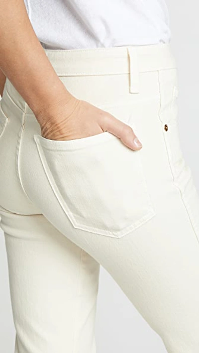 Shop Khaite Vivian New Bootcut Flare Jeans Denim Ivory