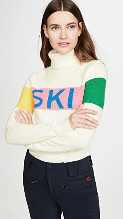 Perfect Moment Intarsia Merino Wool Turtleneck Sweater In Snow White/peach Pink Rainbow