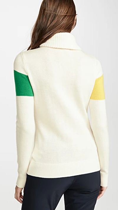 Perfect Moment Intarsia Merino Wool Turtleneck Sweater In Snow White/peach Pink Rainbow