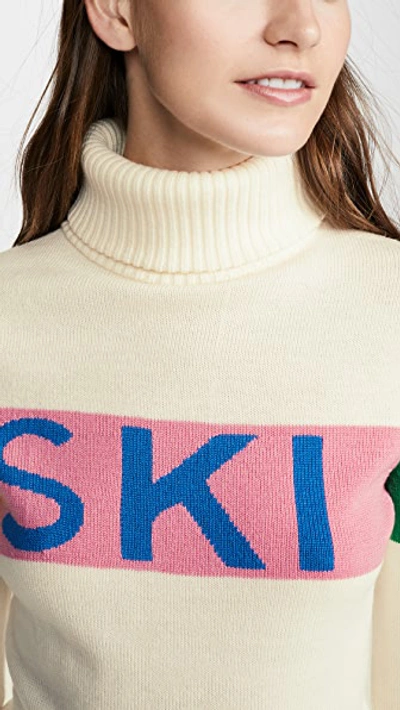 Perfect Moment Intarsia Merino Wool Turtleneck Sweater In Snow White/peach Pink Rainbow