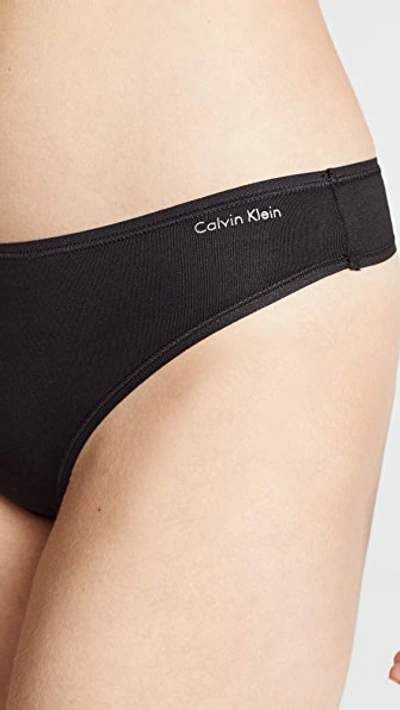 Shop Calvin Klein Underwear Form Thong In Black