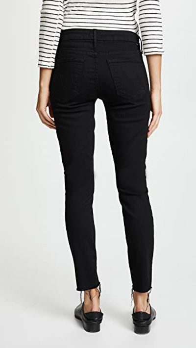 Shop Mother The Looker Frayed Ankle Jeans In Guilty As Sin