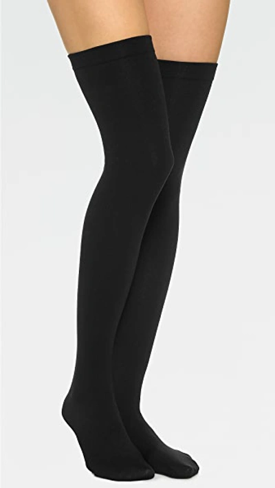Shop Plush Fleece Lined Thigh High Socks In Black