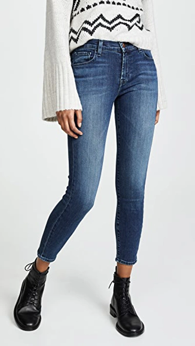 Shop J Brand 835 Mid Rise Crop Skinny Jeans In Swift