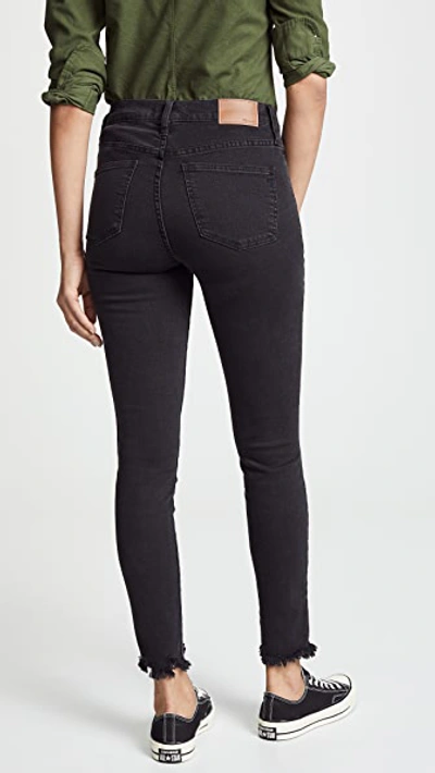 Shop Madewell Mid Rise Skinny Jeans In Black