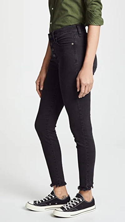 Shop Madewell Mid Rise Skinny Jeans In Black