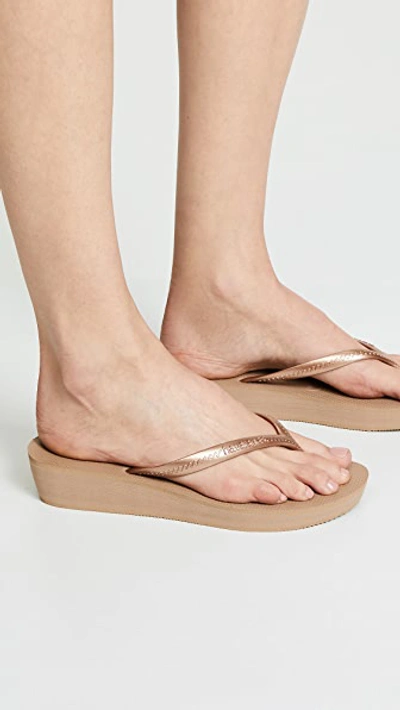 Shop Havaianas High Light Wedge Flip Flops In Rose Gold