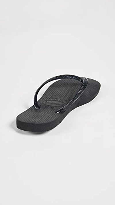 Shop Havaianas Slim Flip Flops In Black