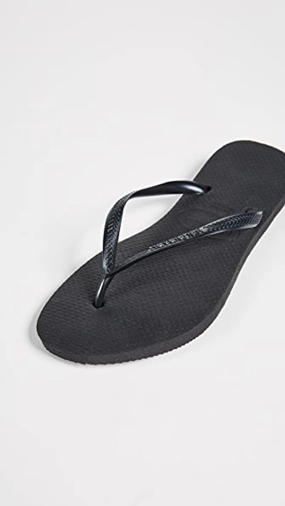 Shop Havaianas Slim Flip Flops In Black