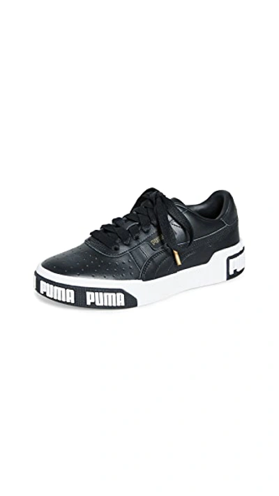 Shop Puma Cali Bold Sneakers In  Black/metallic Gold
