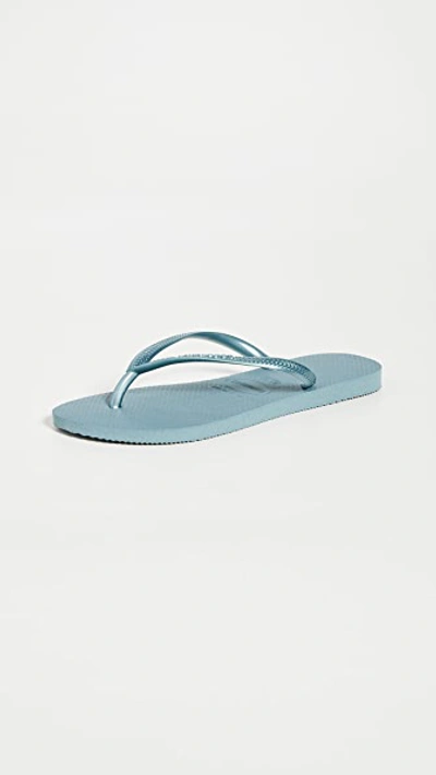 Shop Havaianas Slim Flip Flops In Silver Blue