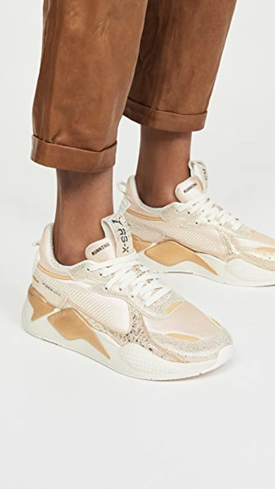 Shop Puma Rs-x Winter Glimmer Sneakers In White/black/team Gold