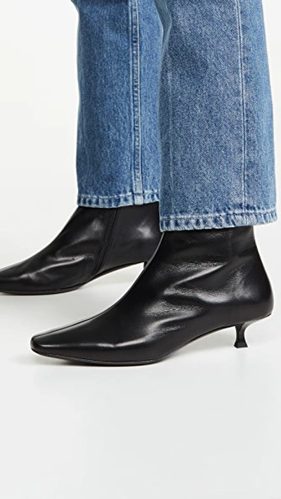 Shop By Far Laura Booties In Black